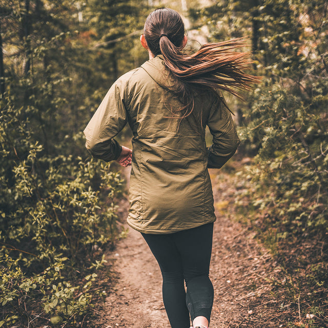 rear view of female trail runner wearing Ventus active layer