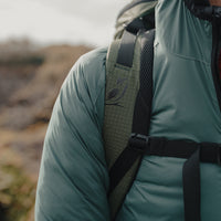 Close-up of Nebo Windbreaker and backpack strap, Detail view of Nebo Windbreaker shoulder and pack strap