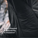 Close-up of a black insulated garment with a perforated, breathable fabric panel and white text reading 'Body-Mapped Breathability & Insulation' over a blurred outdoor background.