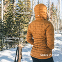 rear view of woman wearing mustard yellow puffy down jacket with fitted hood and adjustable hem.