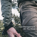 man unzips mesh-backed side vent in high mountain environment
