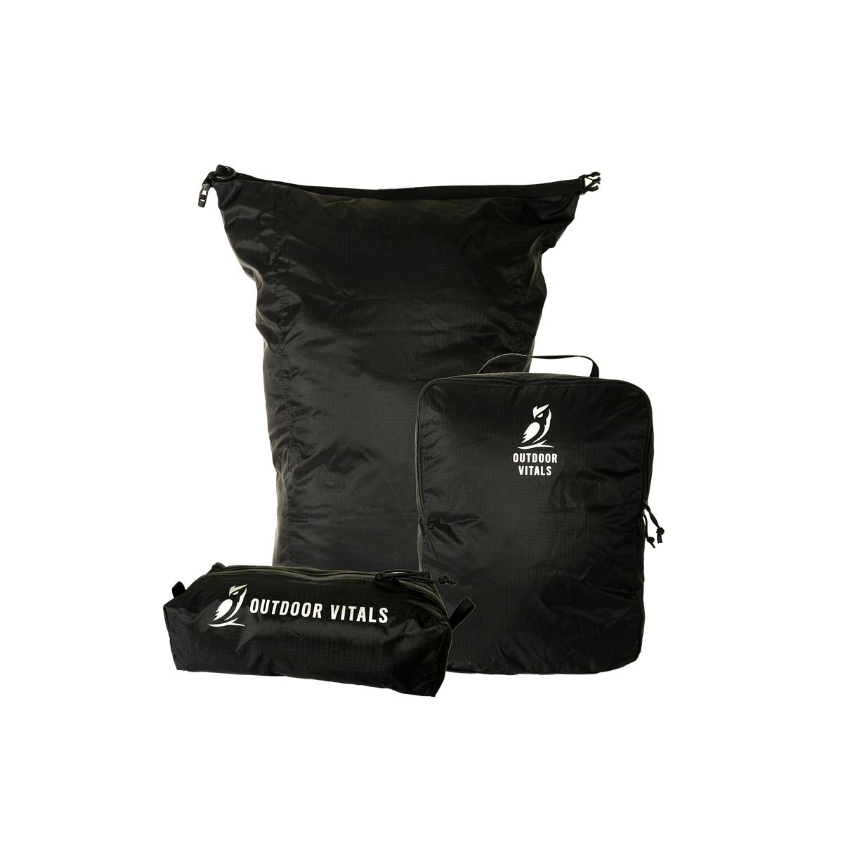 Product shot featuring Outdoor Vitals ultralight travel organization accessories, including a dry bag, a packing cube, and a zippered dopp kit pouch.